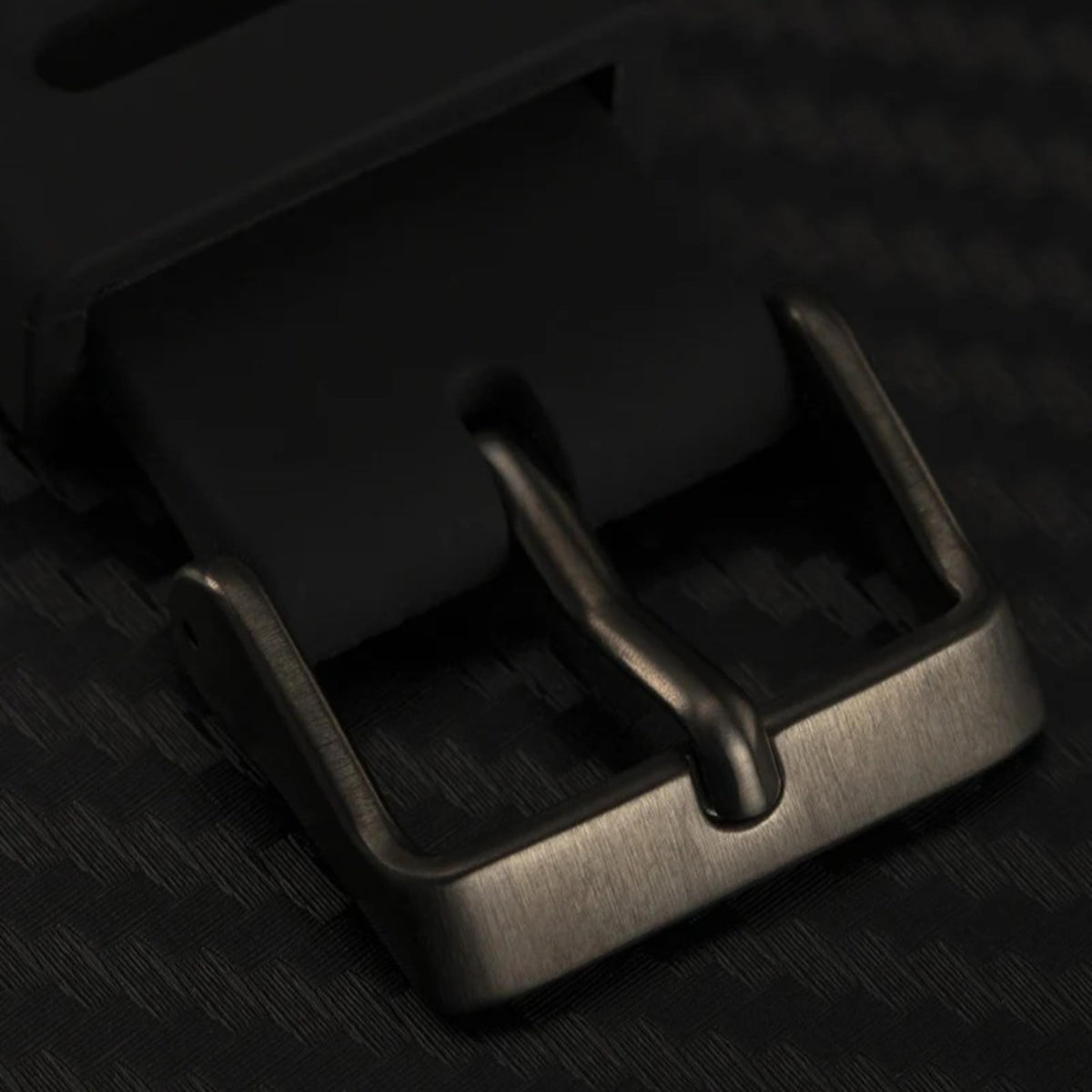 Black silicone watch strap with metal clasp and buckle closure