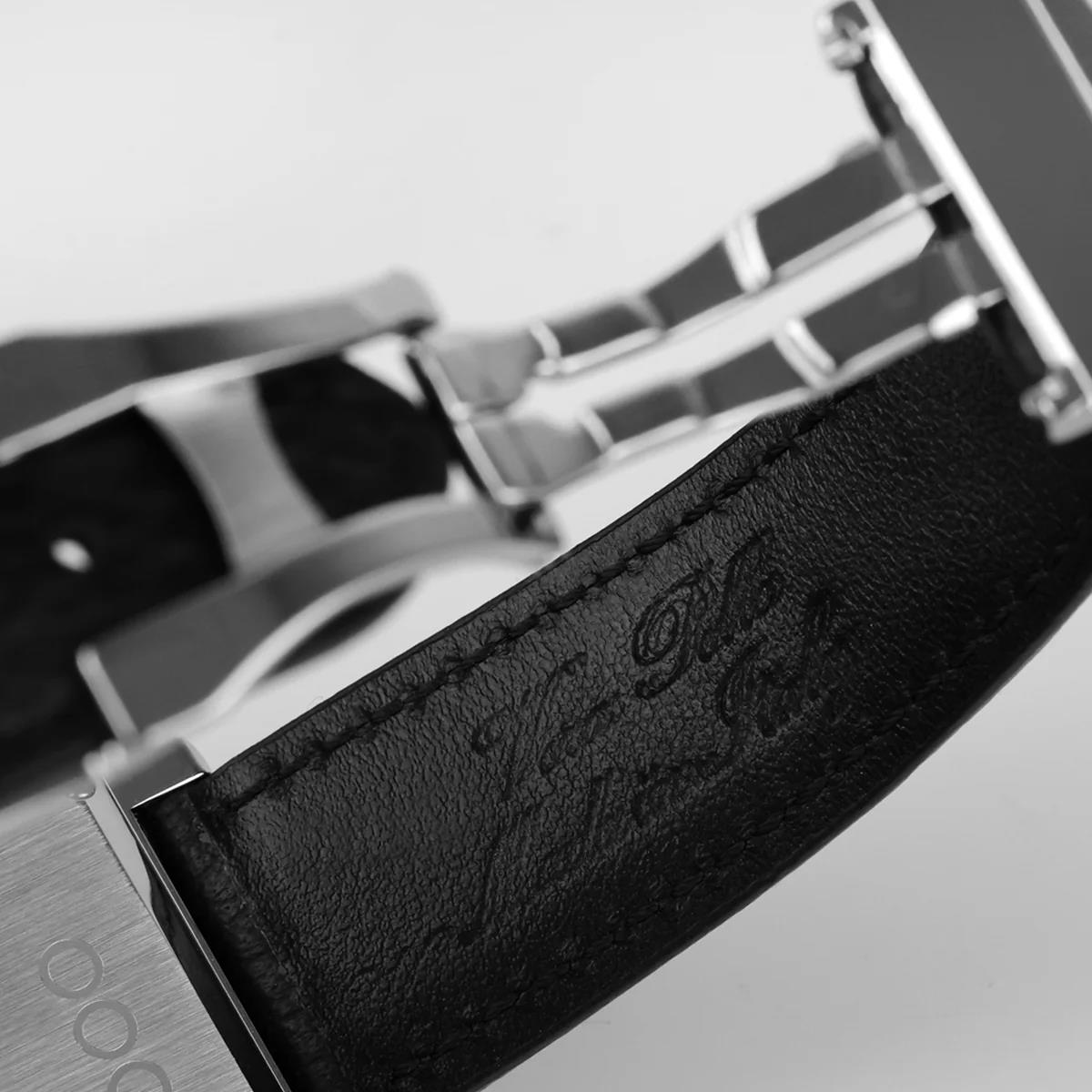 Black embossed leather watch strap with metal buckle keeper