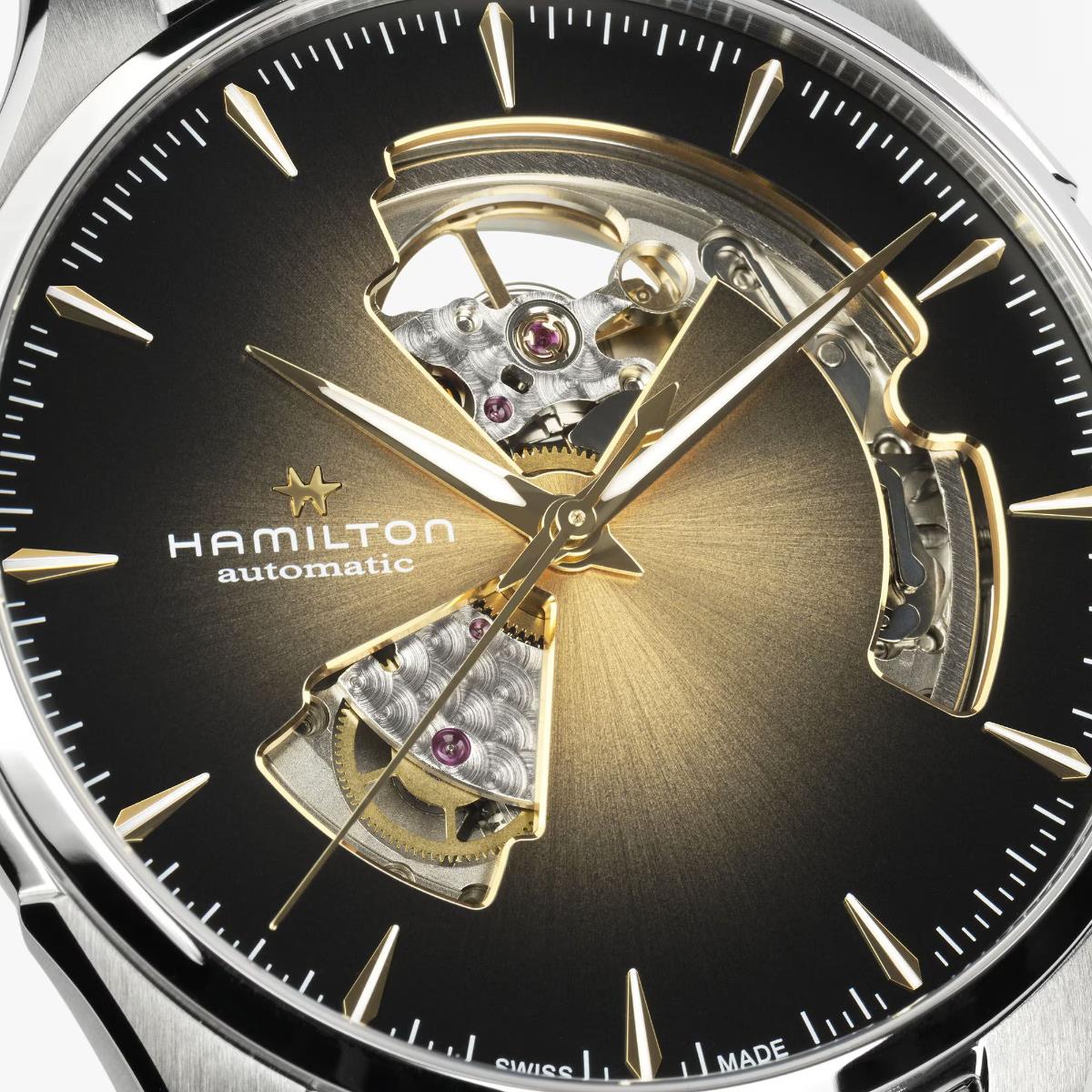 Hamilton Jazzmaster H32675501 skeleton dial close-up highlighting gold tone hands, baton indices, and exposed mechanical balance wheel