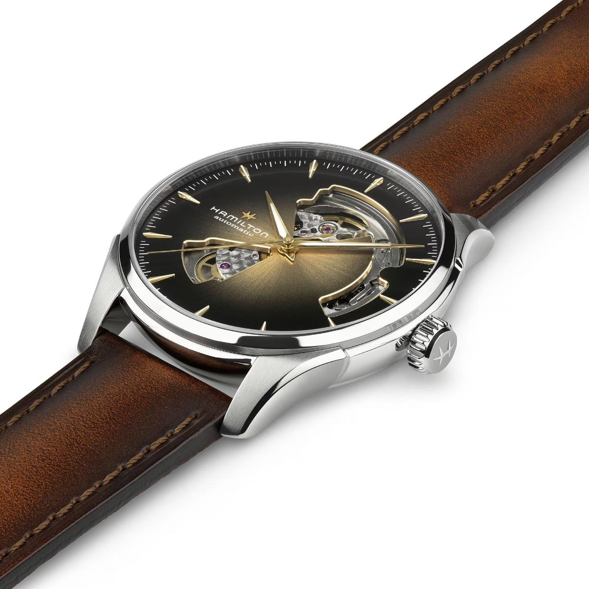 Hamilton Jazzmaster H32675501 self-winding timepiece studio shot displaying brown leather band, silver lugs, and open heart dial aperture