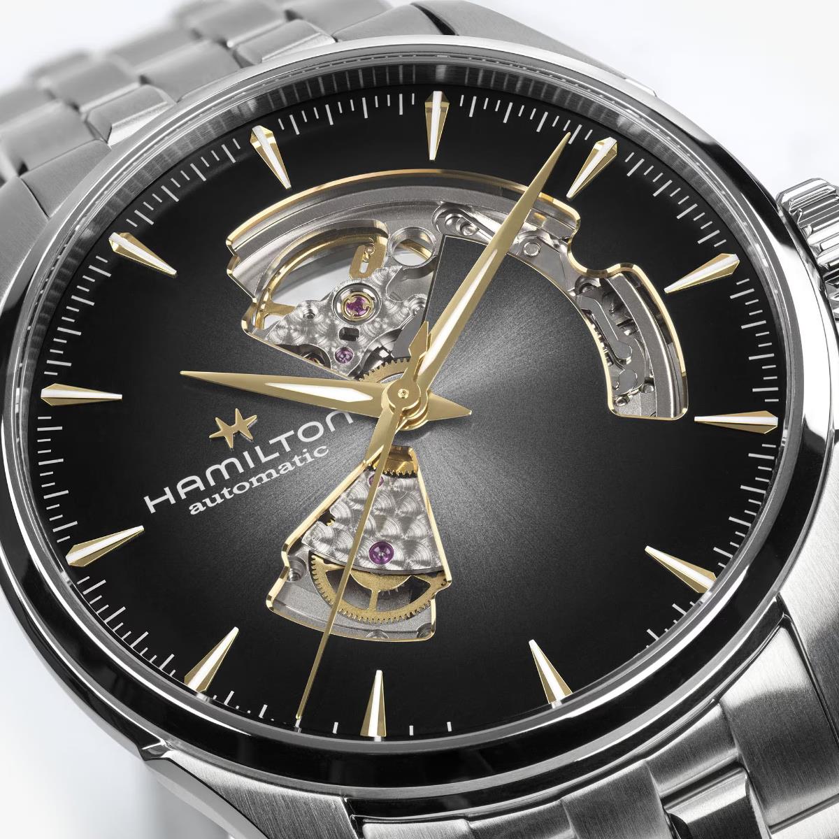 Black dial open-heart automatic watch close-up with exposed gold-toned movement