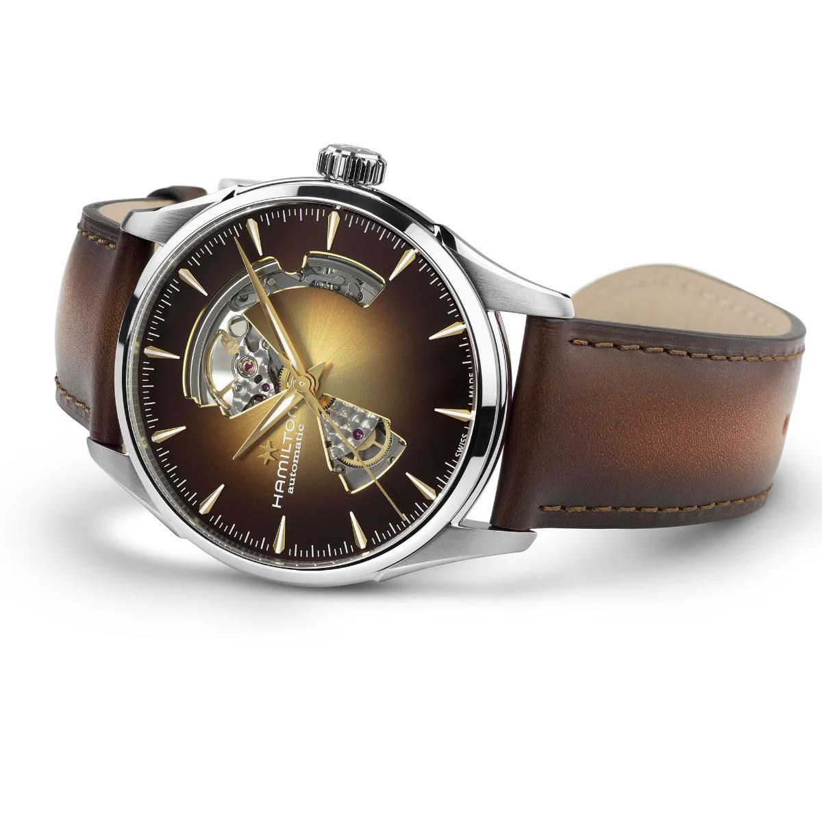 Hamilton Jazzmaster H32705501 mens watch studio shot showing open heart cutout, brown dial, and polished steel case