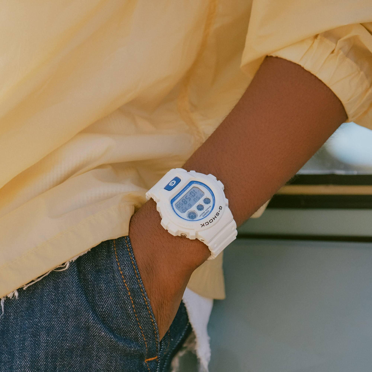 Casio G-Shock DW-6900HDS-7ER white resin strap lifestyle view on a wrist