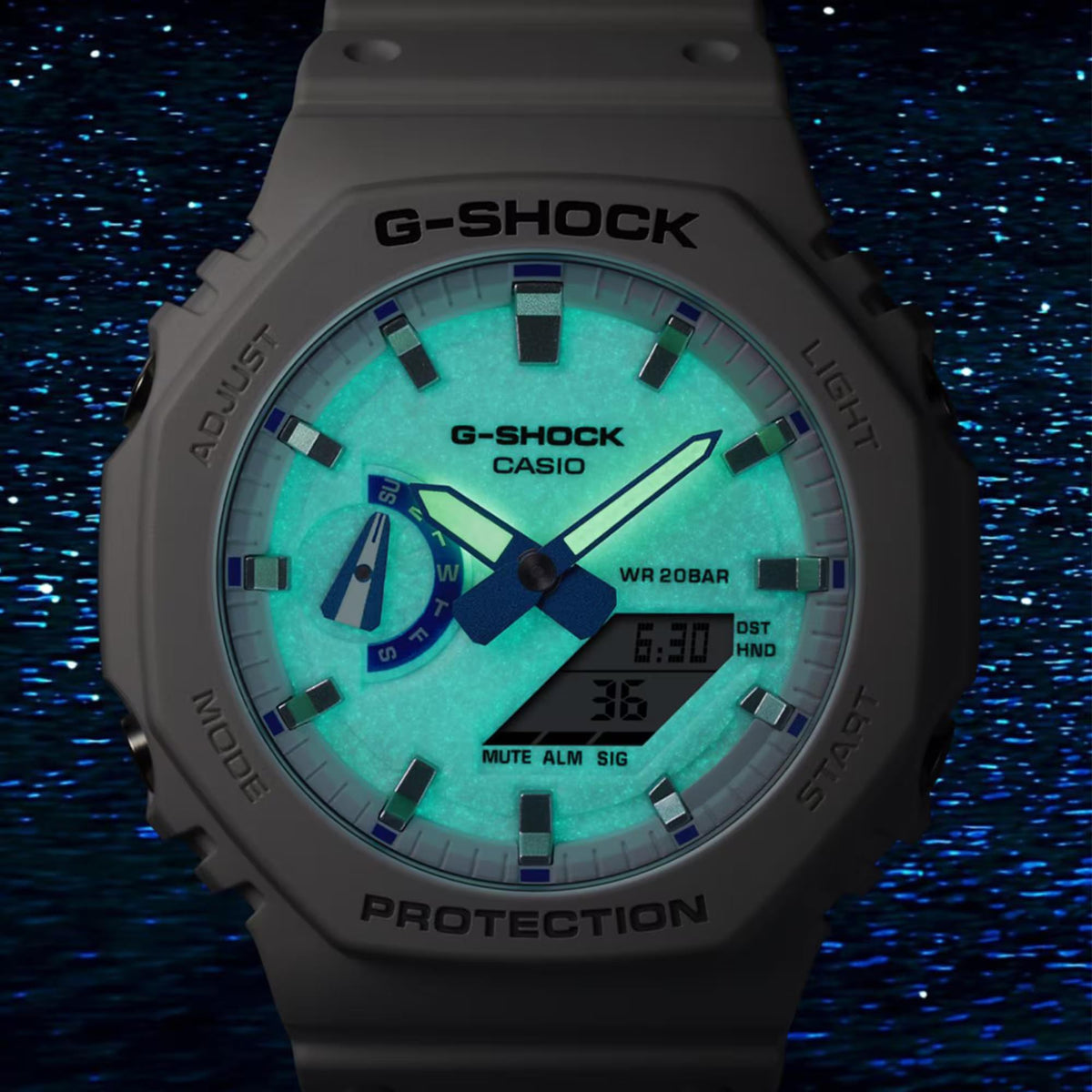 Light gray resin G-Shock watch with green illuminated dial and digital display