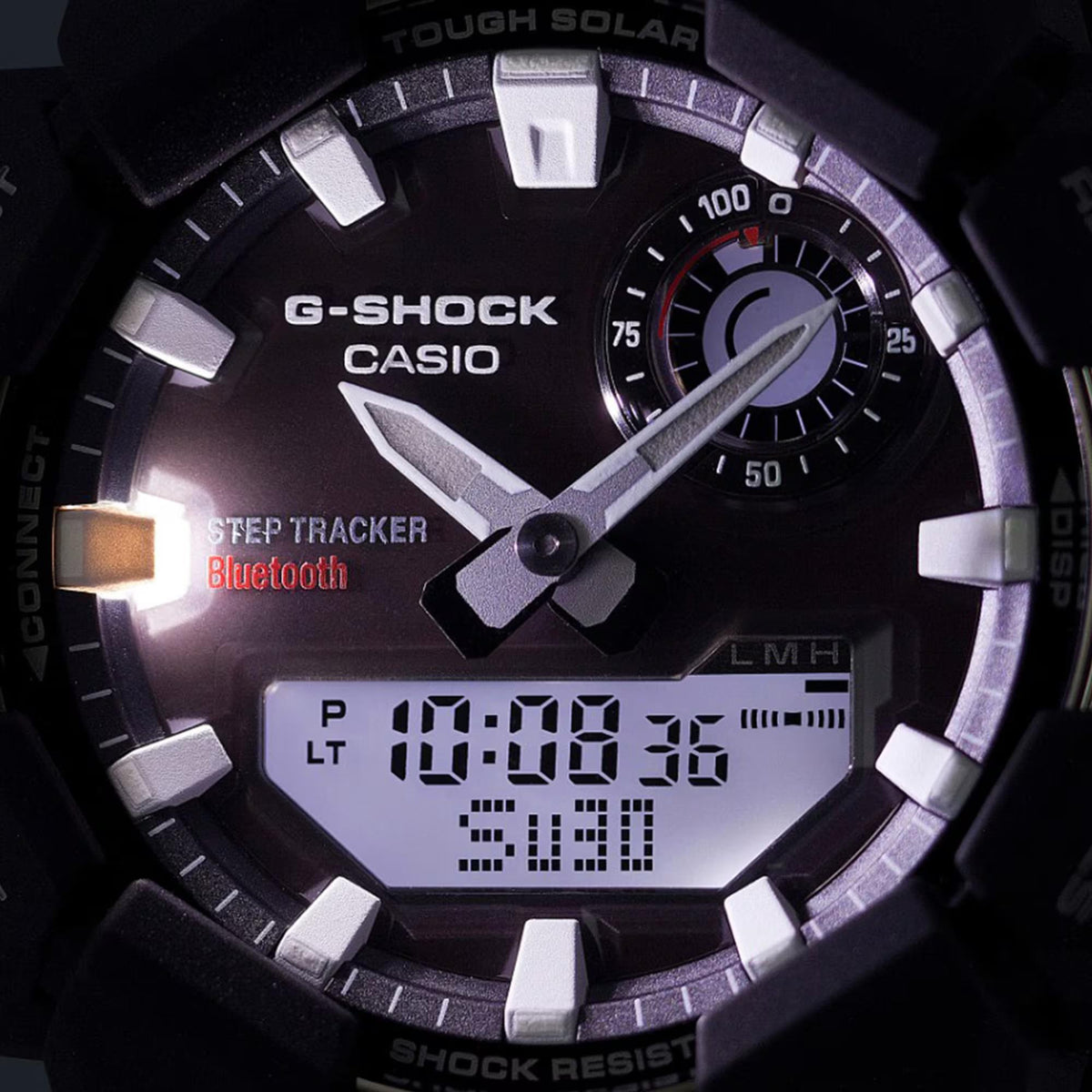 Green G-Shock watch face close-up with step tracker Bluetooth text and digital time
