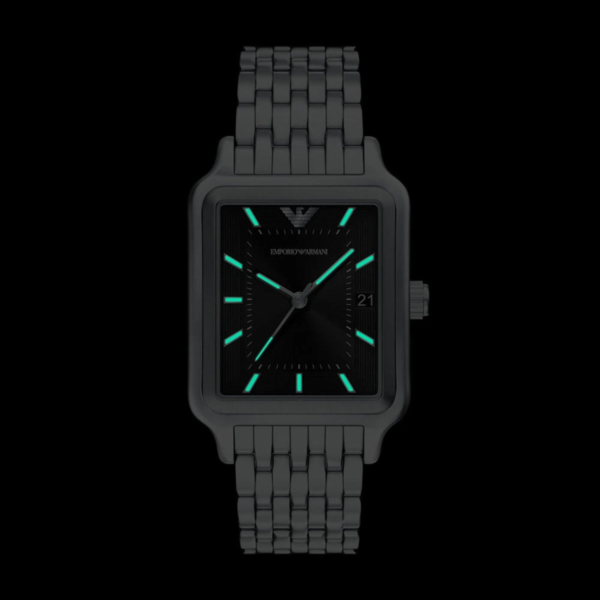 Front view of the Emporio Armani AR11755 watch in the dark highlighting the luminescent hands and hour indices