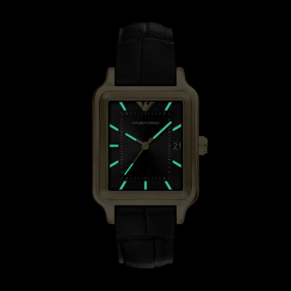 Ladies quartz wristwatch with glowing black dial, gold-tone case, and black leather strap.