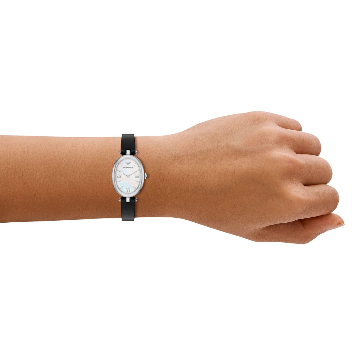 On-wrist perspective of the Emporio Armani Sinfonia AR11778 timepiece displaying the delicate oval white mother of pearl dial and slim black leather band