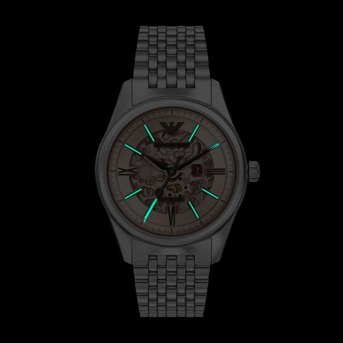 Dark view showcasing the luminous hands and hour markers on the Emporio Armani Antonio AR60095 skeleton wrist watch