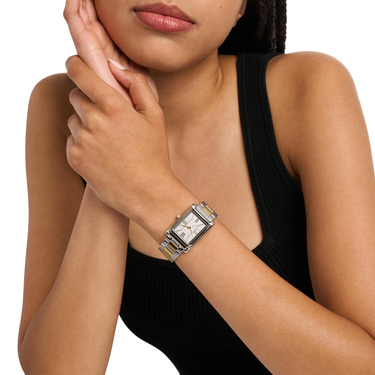 Michael Kors Essex MK4967 women's watch styled on a wrist, displaying the silver dial, rectangular case, and two-tone bracelet
