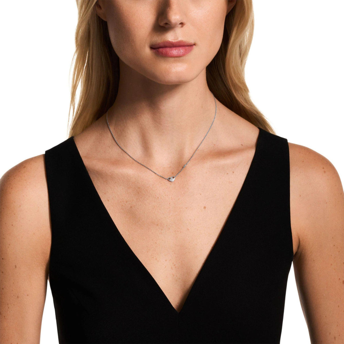 Model wearing Emporio Armani Marina's Love womens sterling silver heart pendant necklace EG3646040