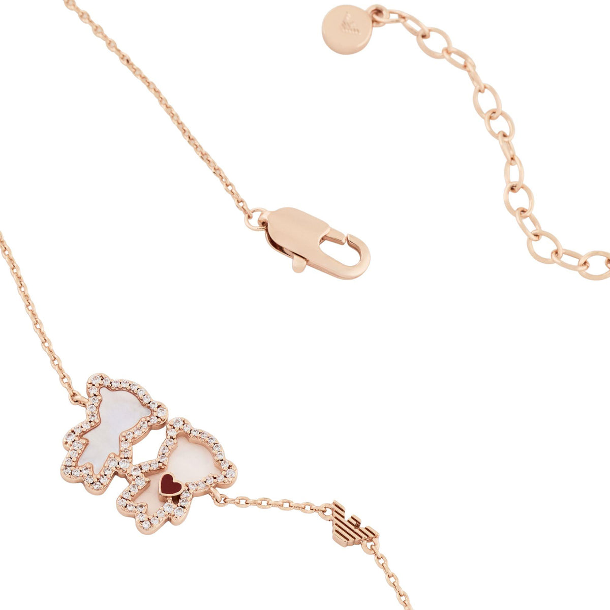 Rose gold tone necklace detail with lobster clasp and heart-and-bear charm drops