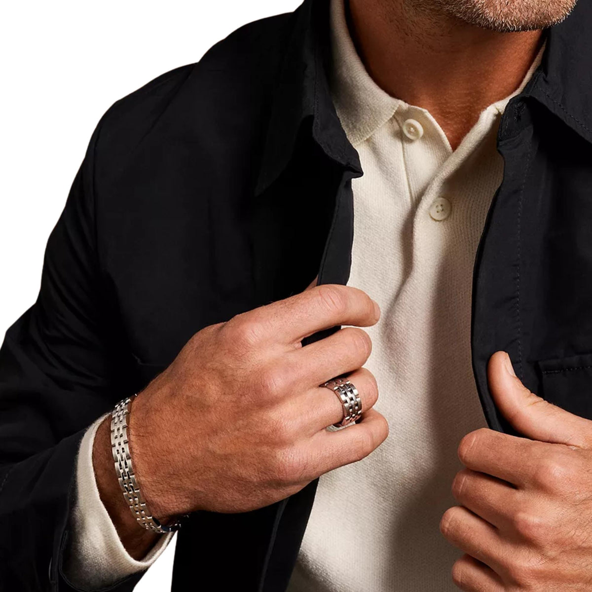 Stainless steel chain bracelet on a man’s wrist with interlocking rectangular links