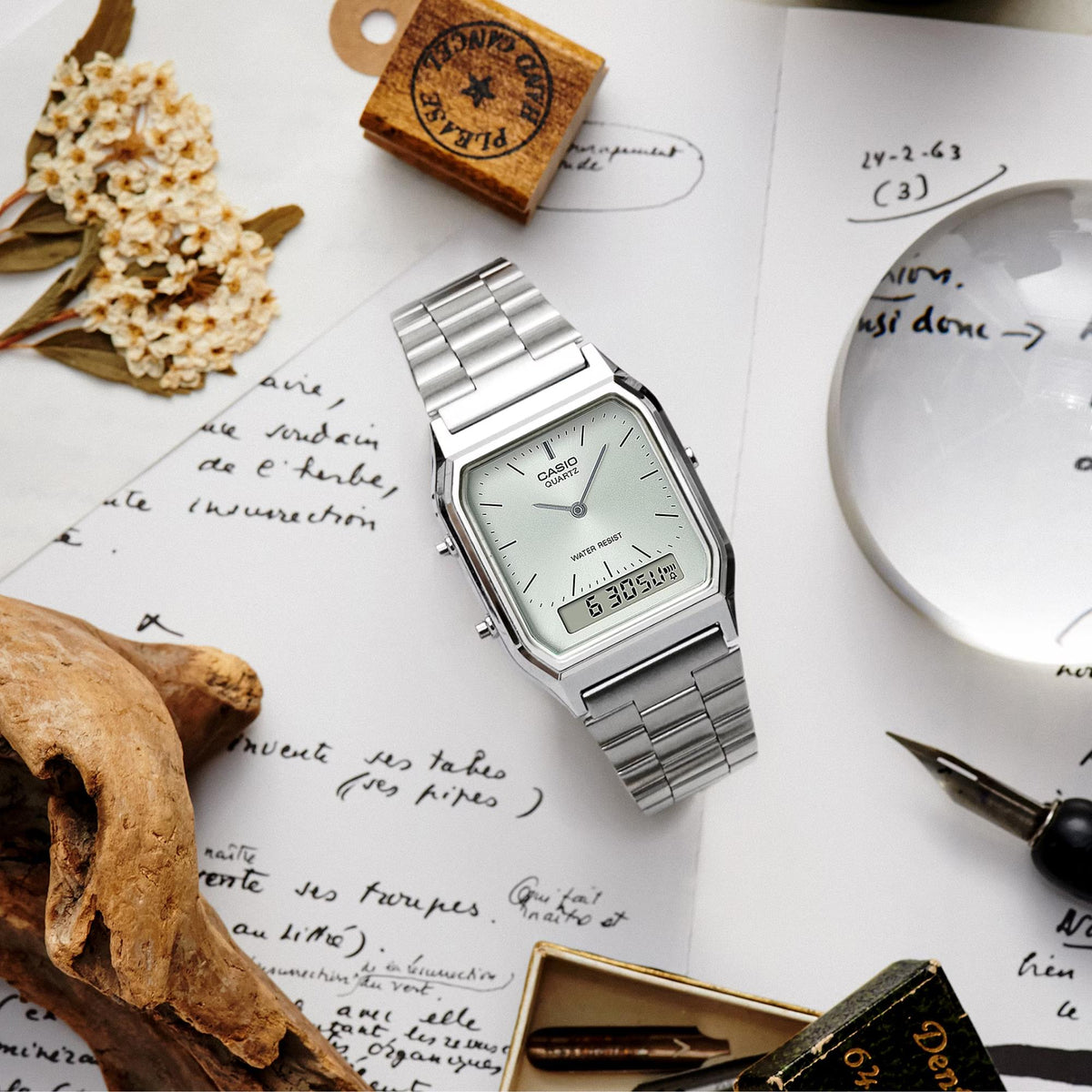 Casio silver steel quartz wrist watch, white dial, metal bracelet, digital time window