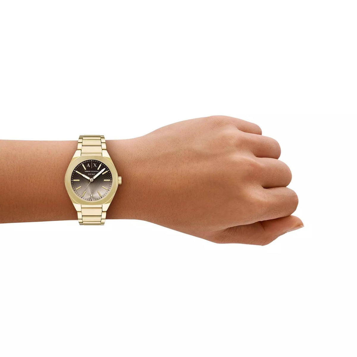 Armani Exchange Sync brown dial womens quartz watch worn on wrist showcasing elegant gold tone metal band