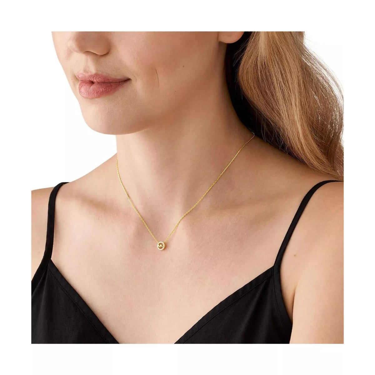 Gold-tone pendant necklace with small round MK charm at center on fine chain