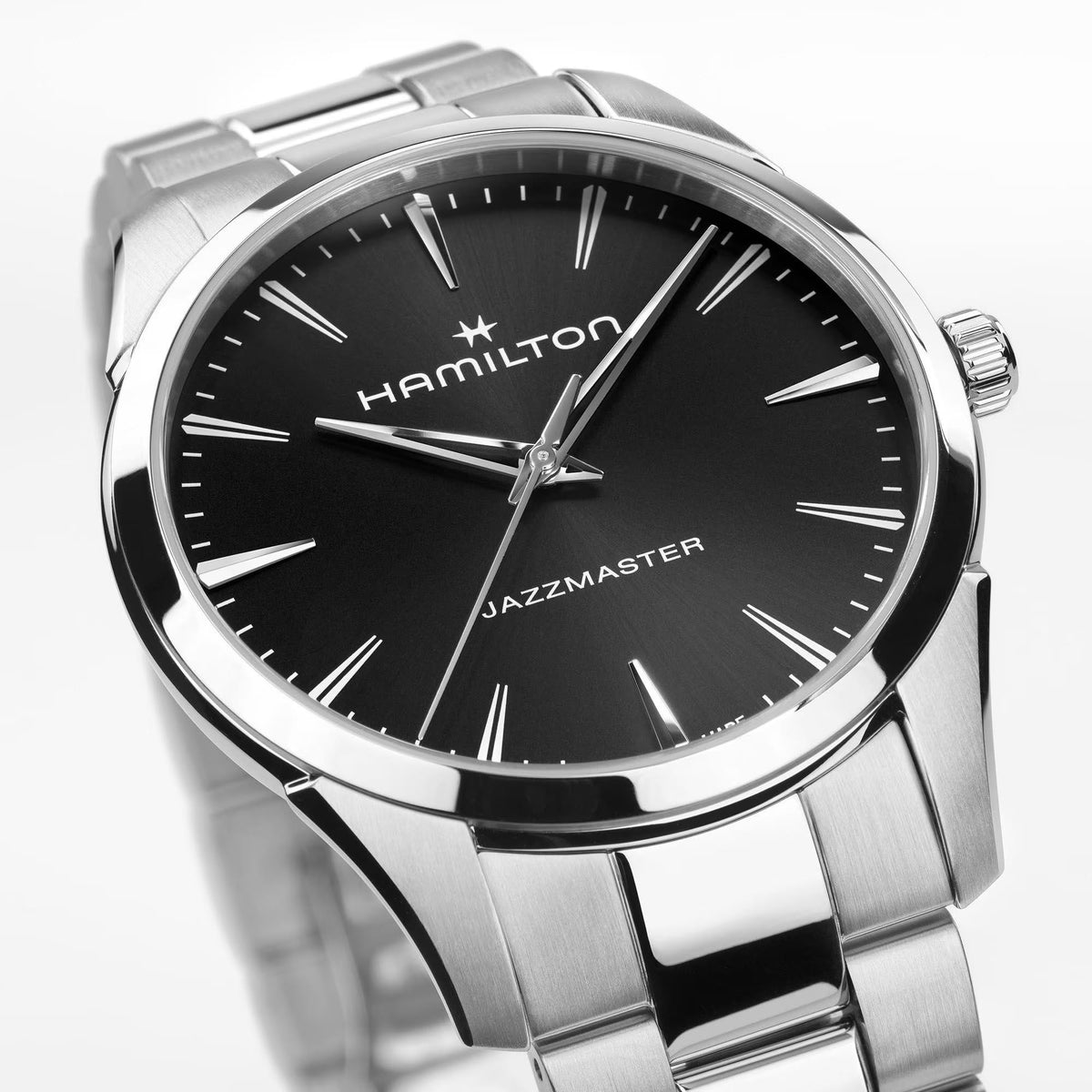 Hamilton Jazzmaster H32461131 quartz watch dial macro close-up showcasing silver baton indices, polished hands, and black sunburst finish