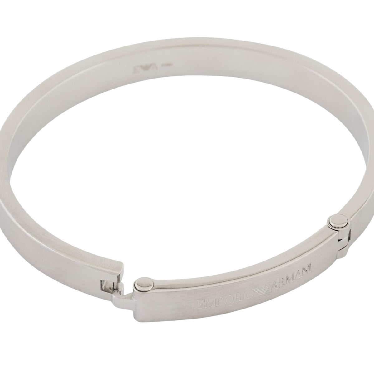 Stainless steel bangle bracelet close-up with hinged clasp and engraved logo, silver-tone