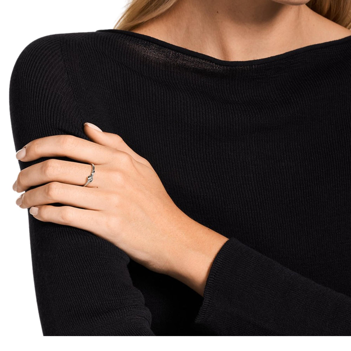 Emporio Armani women's polished silver ring on finger, oval center with logo detail