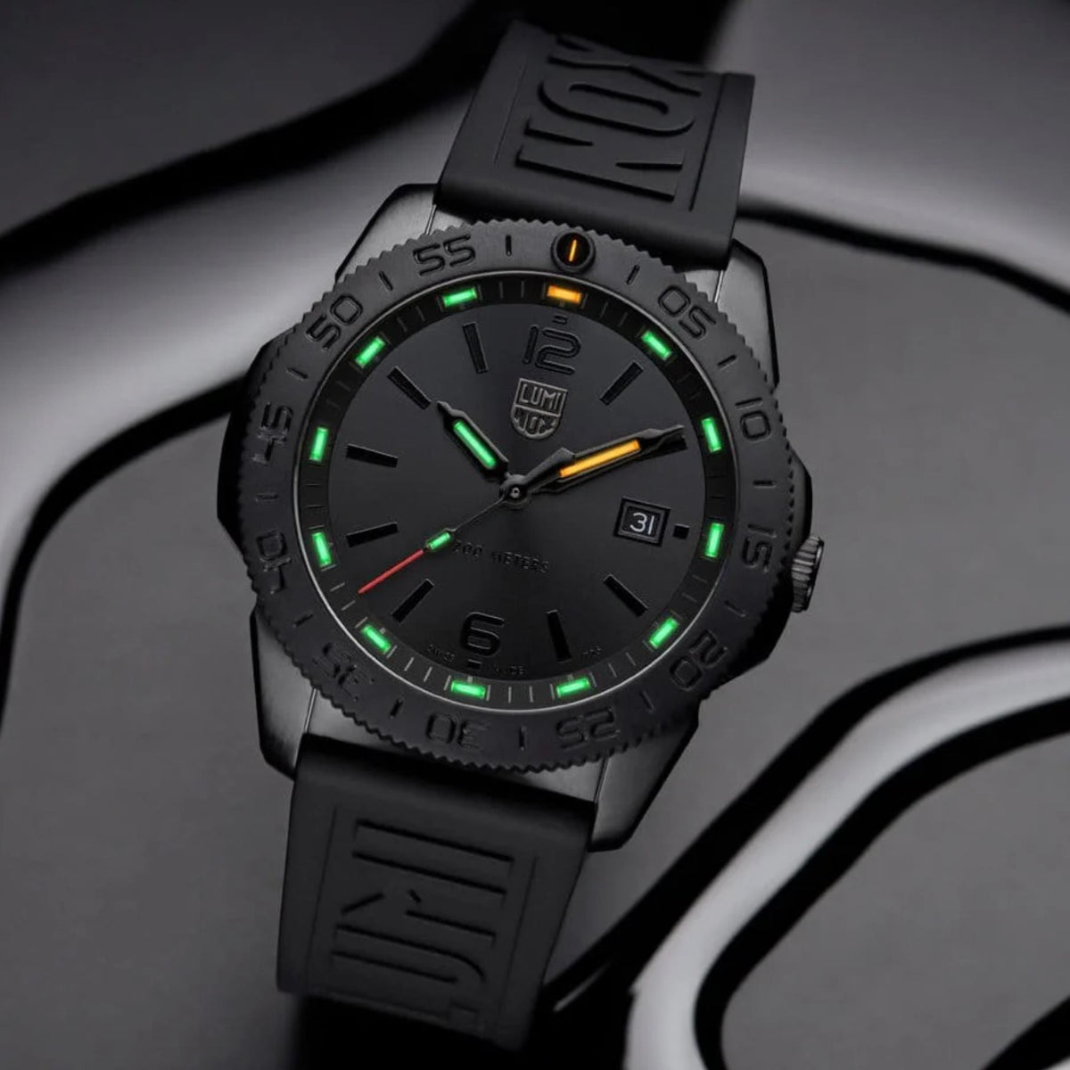 Luminox Pacific Diver black dial with green lume accents and date window
