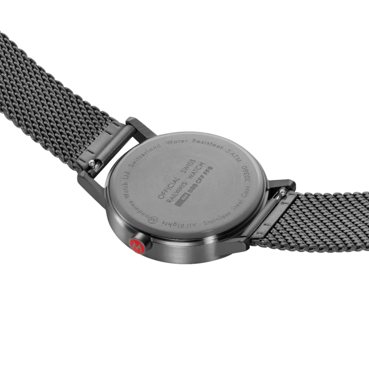 Mondaine watch back with stamped metal case and textured mesh strap links