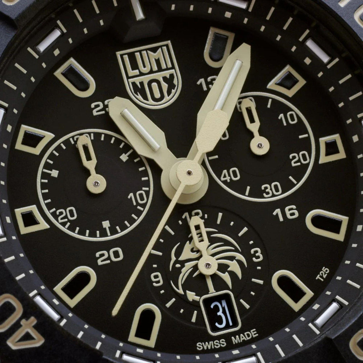 Close-up of black dial chronograph with three subdials and luminous hands