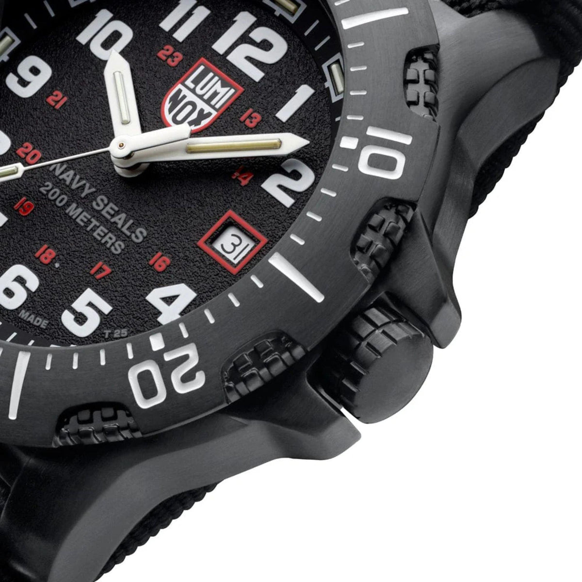Close-up of black case and bezel with crown, rubber strap texture, and date window