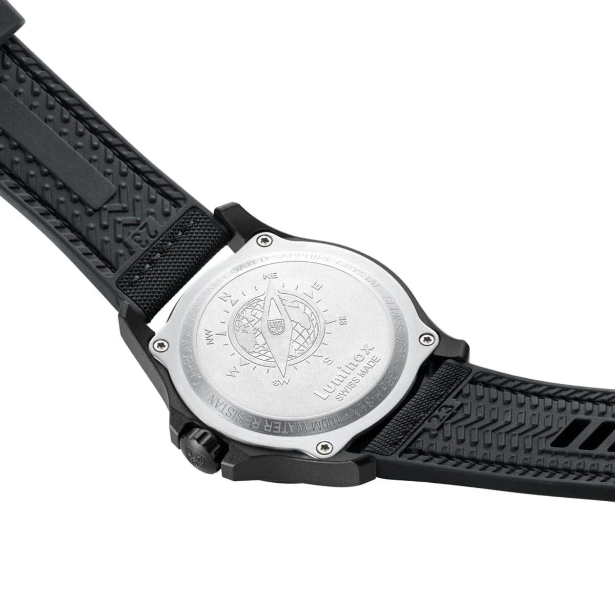 Watch caseback with engraved design and black textured rubber strap underside