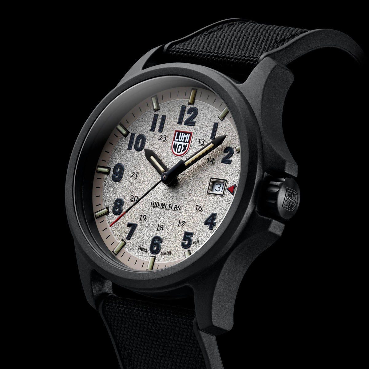 Men's grey dial field watch close-up with black case and black textured rubber band
