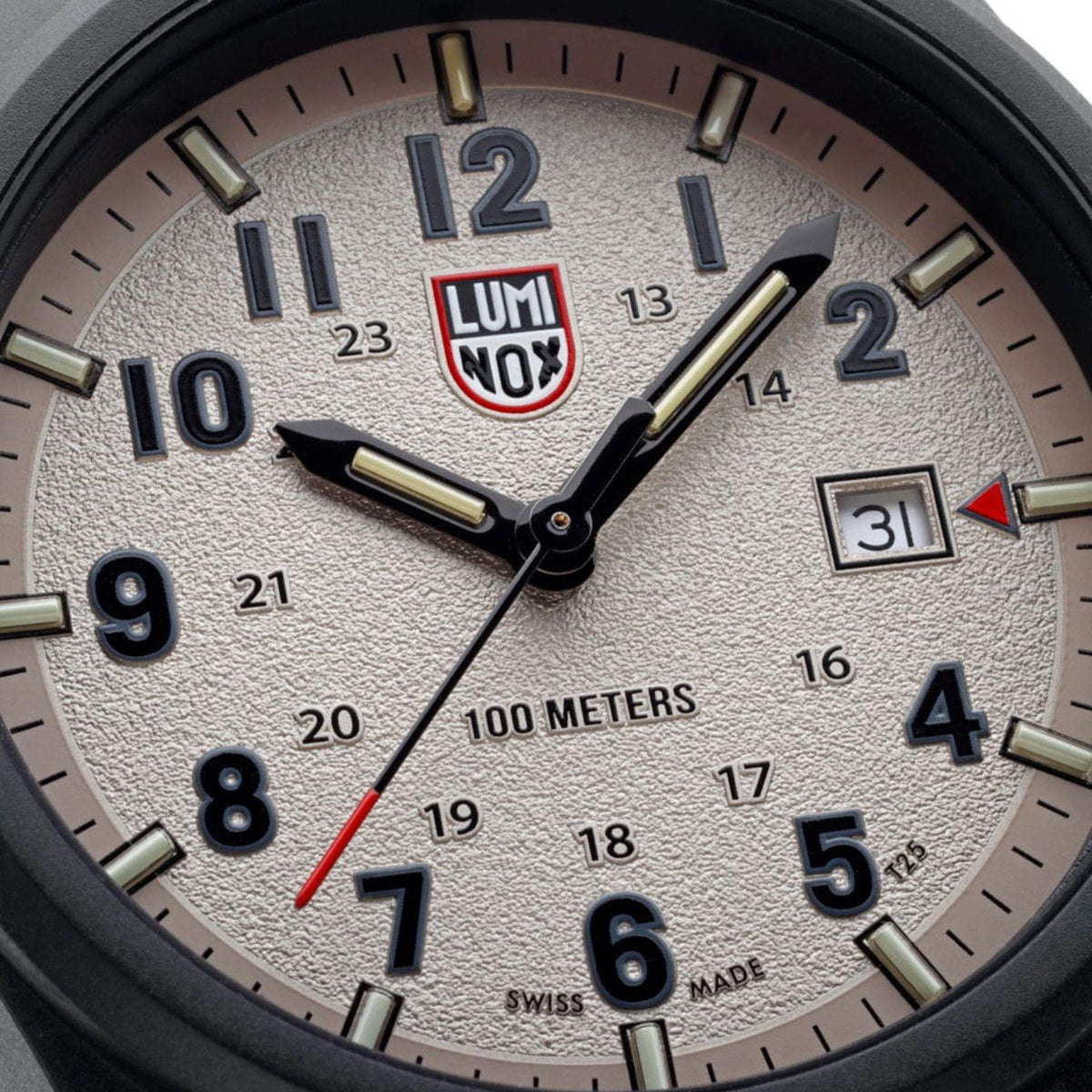 Dial close-up with grey textured background, gold hands, and “100 meters” marker