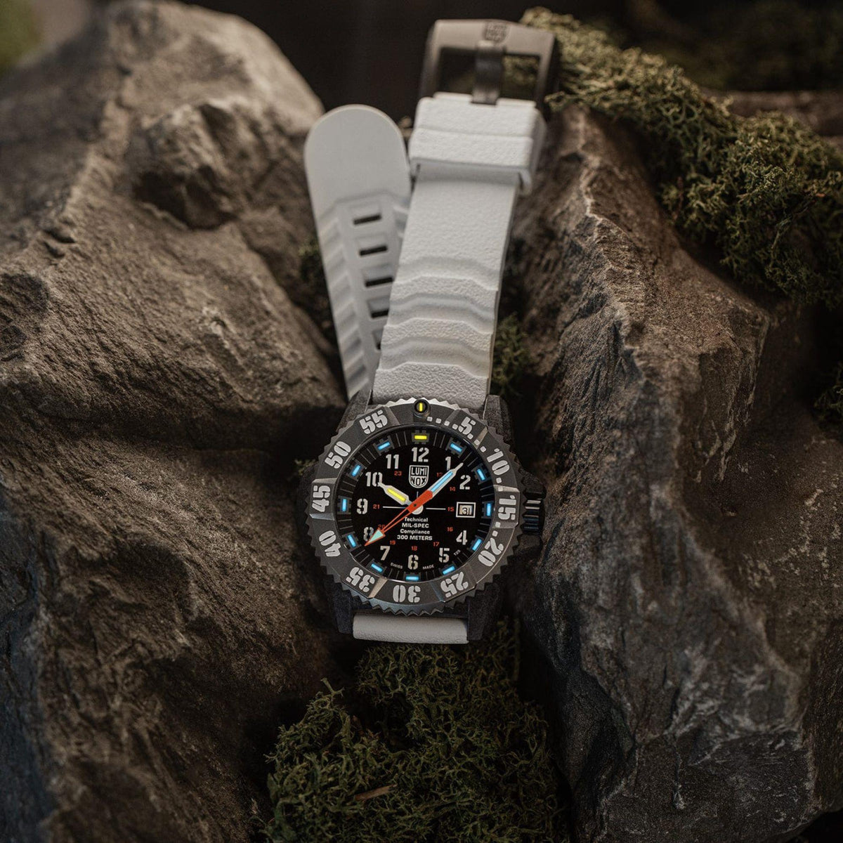 Luminox MIL-SPEC 46mm watch with white rubber strap and dark dial, orange hands