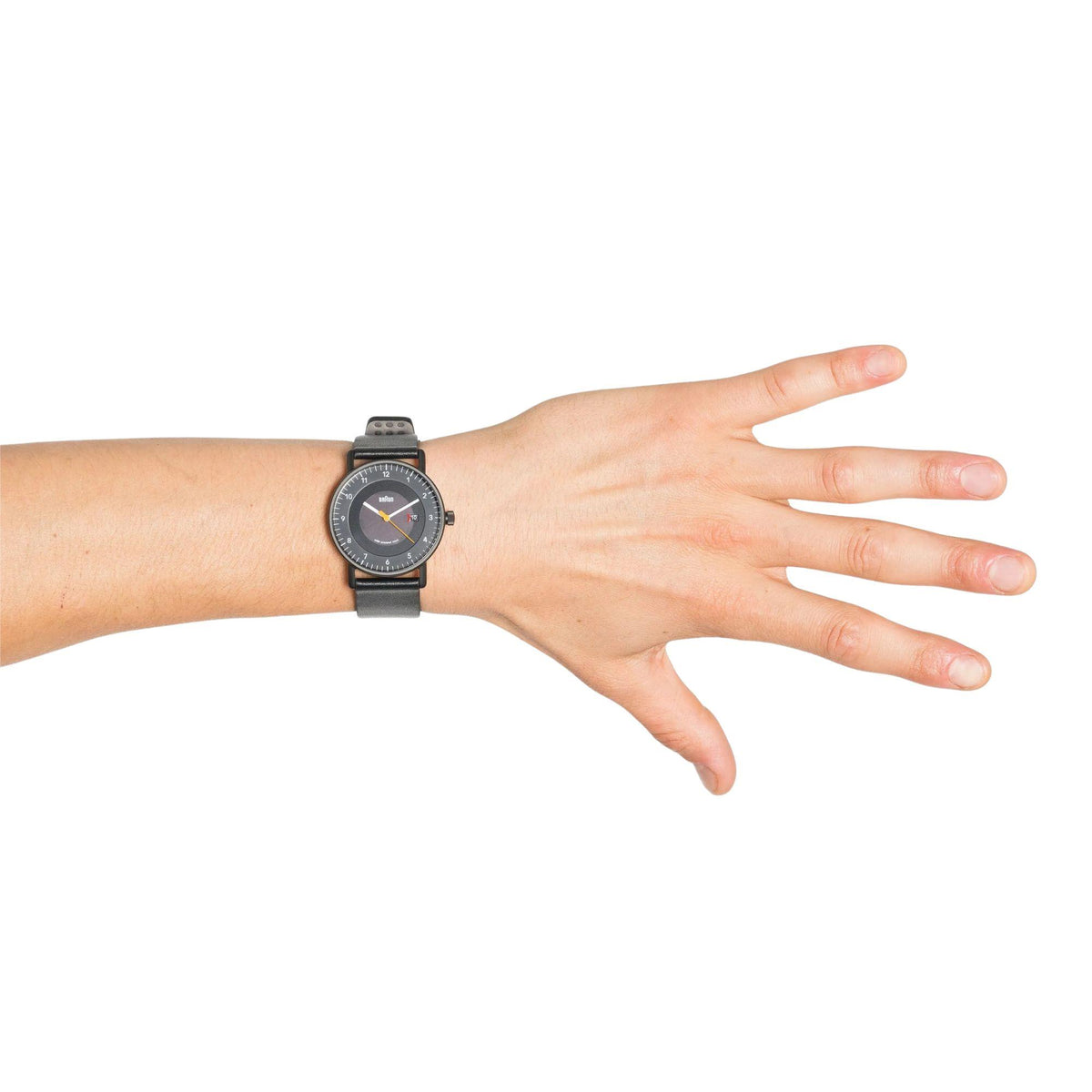 Men's solar powered watch on wrist, black dial with date window at 3 o'clock