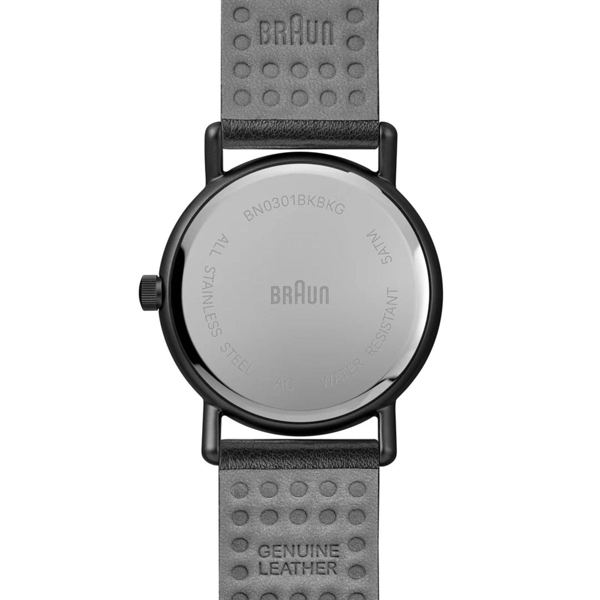 Men's solar powered watch back with black leather strap and stamped case text