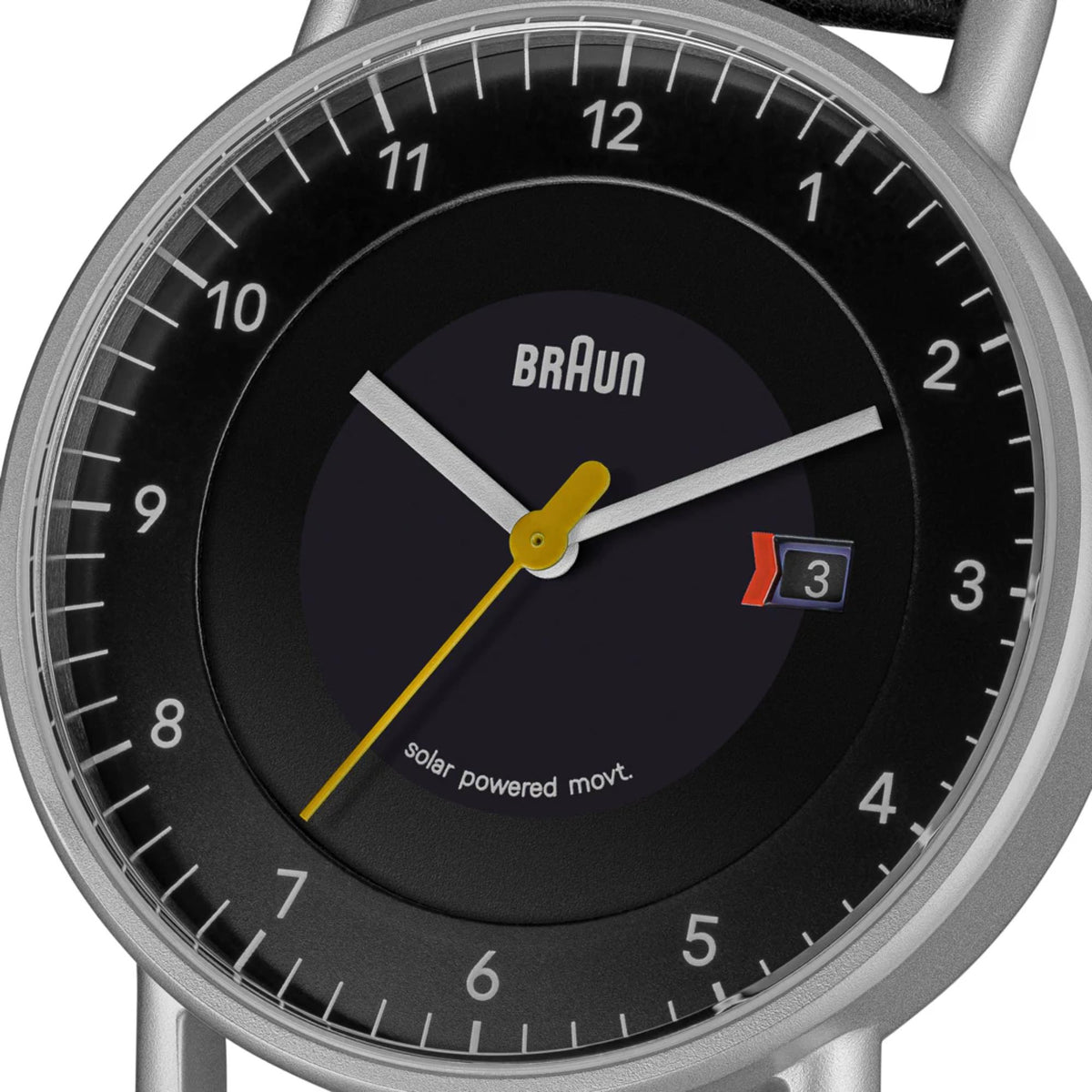 Braun solar-powered watch close-up with black dial, BRaUN logo, date window at 3