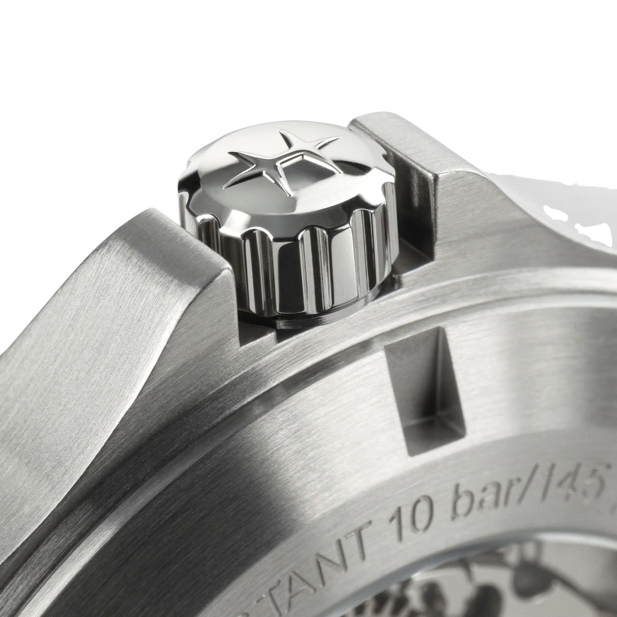 Stainless-steel watch crown and bezel detail with engraved markings