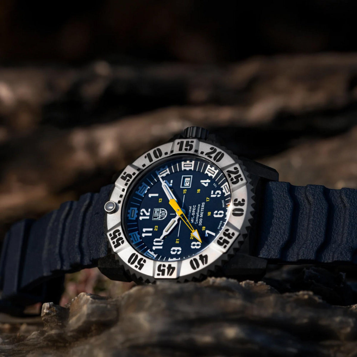 MIL-SPEC watch worn on wrist with blue dial and dark blue rubber strap