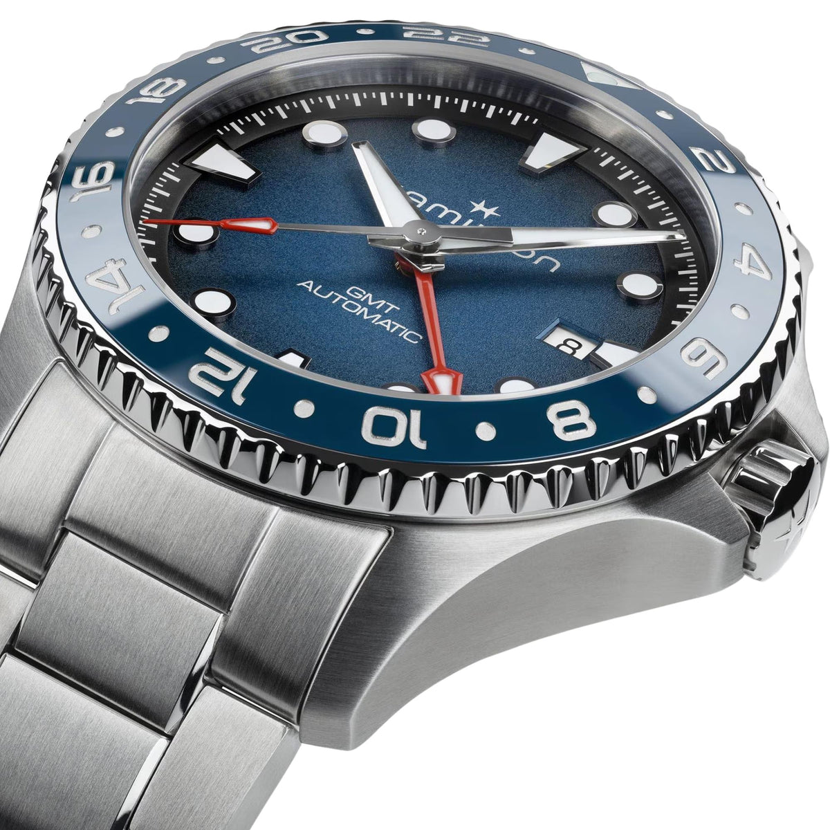 Men's steel diver-style GMT watch with blue dial, blue bezel, and red accents