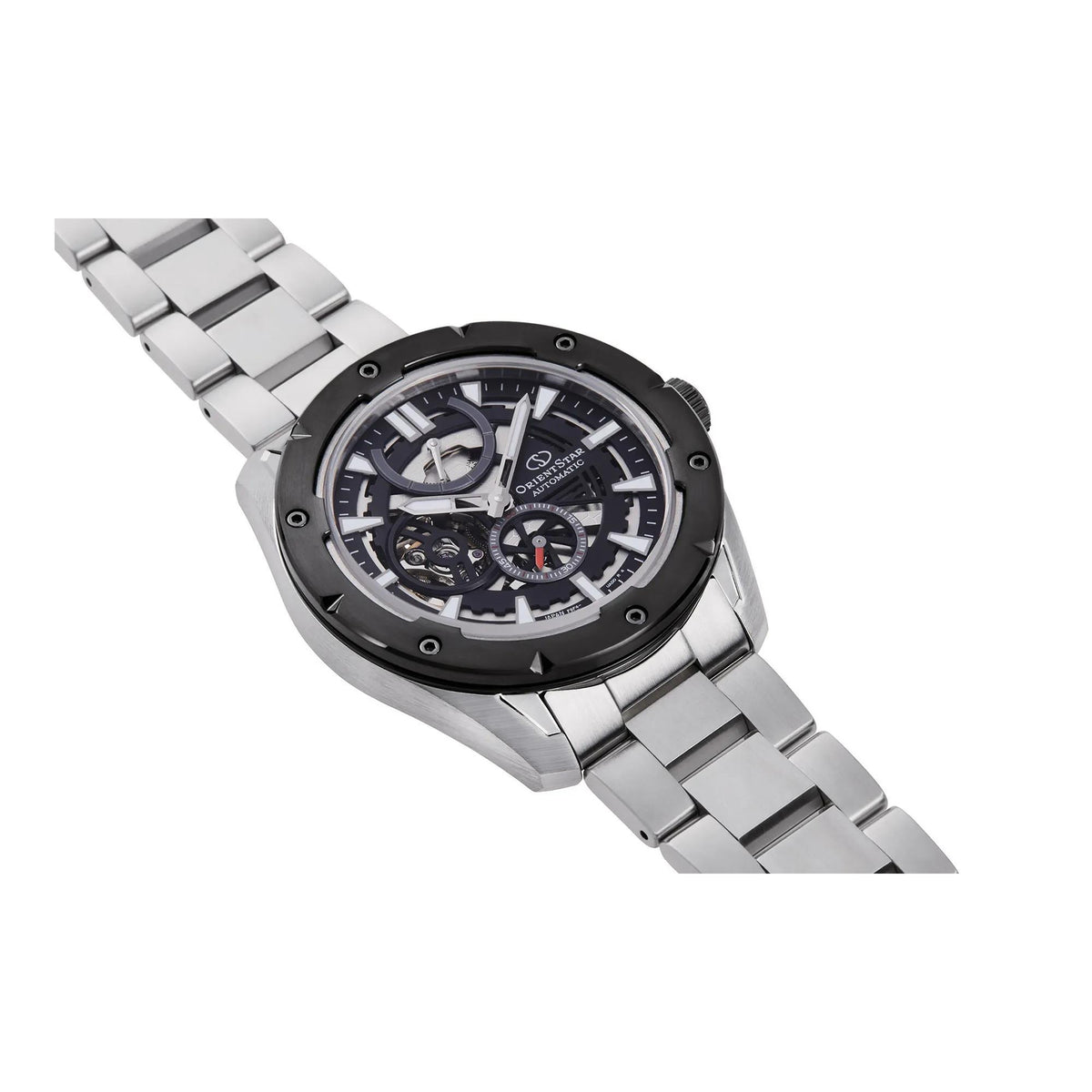 Men's automatic skeleton watch on steel bracelet, black dial, angled side view.