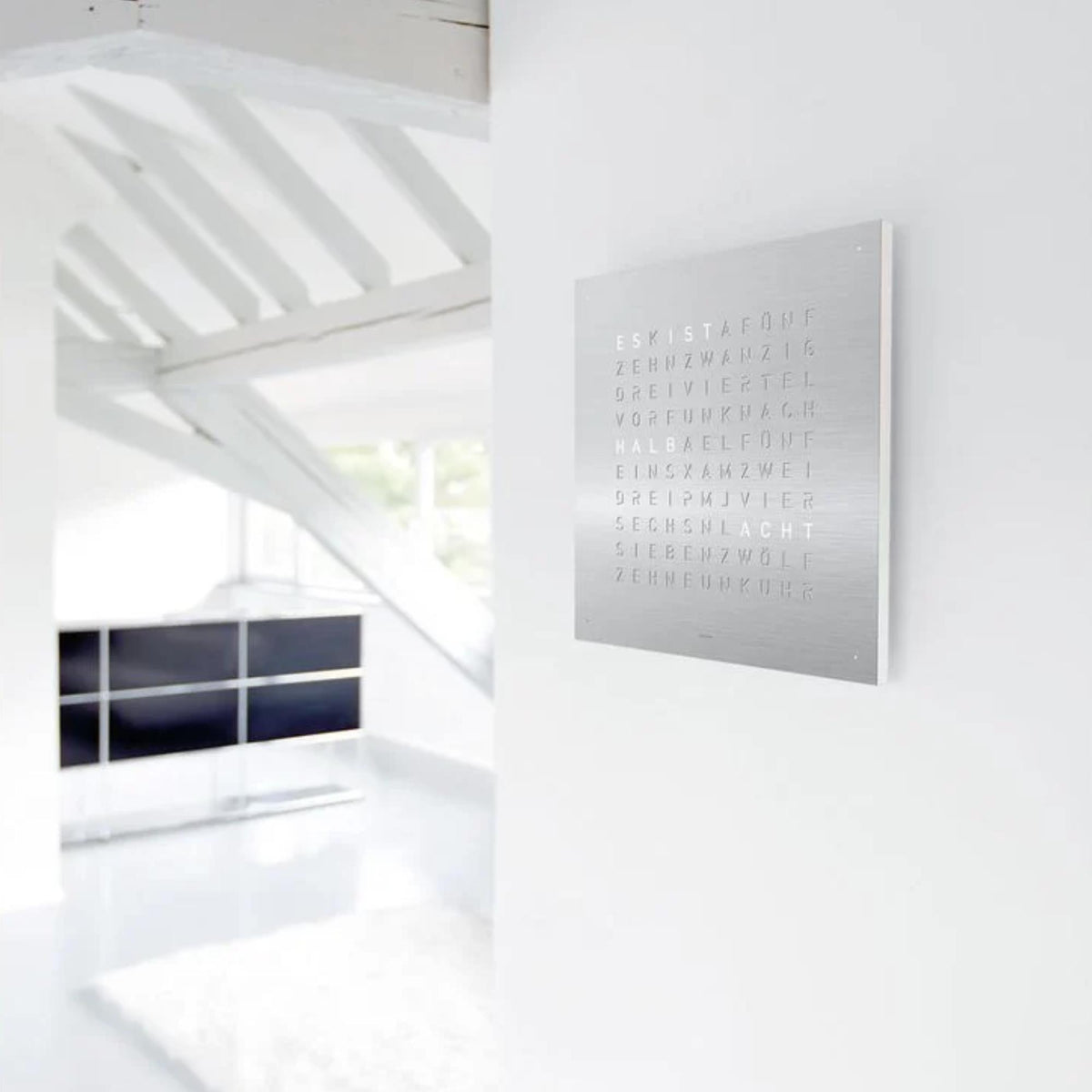 Stainless steel square wall clock panel with engraved text in horizontal rows
