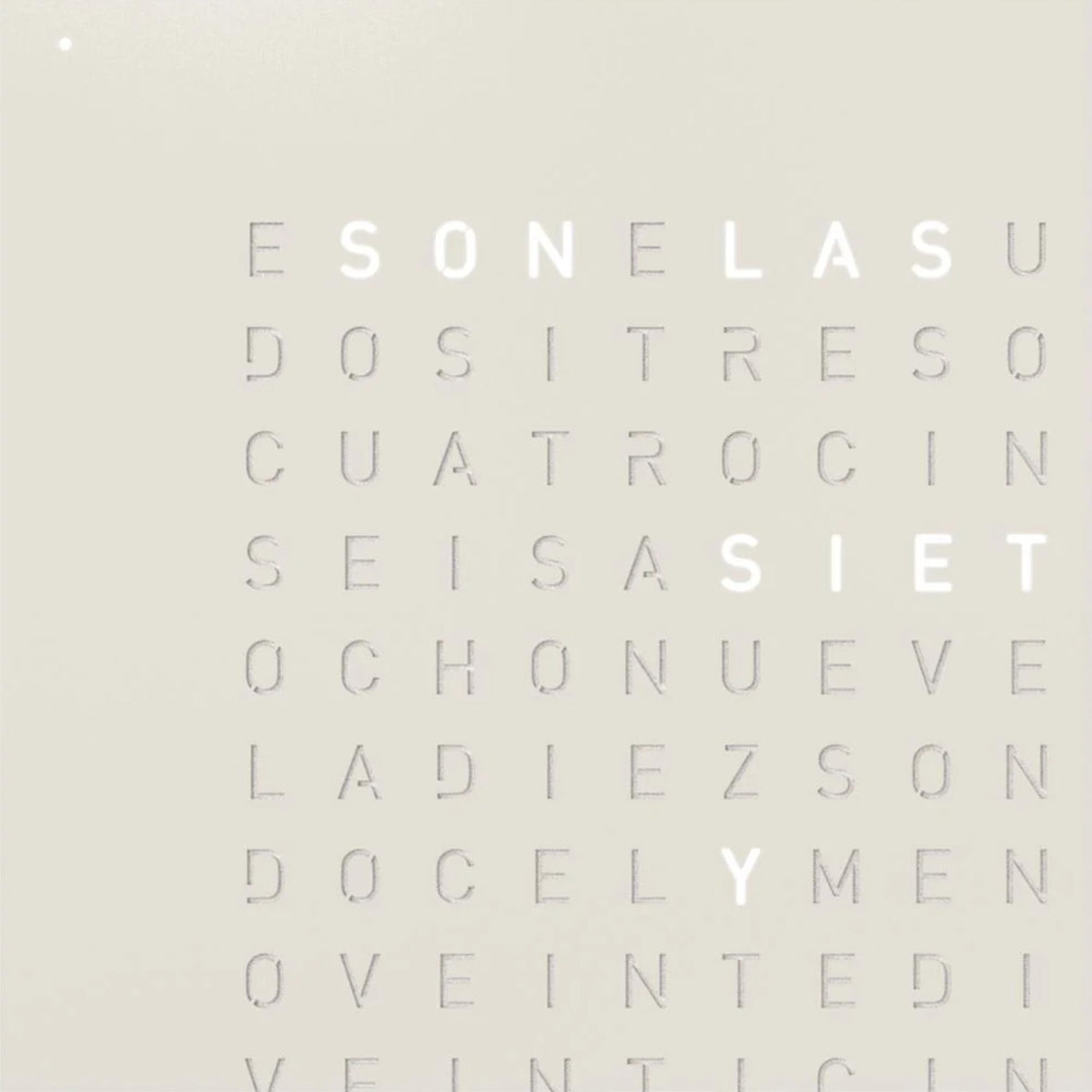Close-up of beige word wall clock panel with English letter lines