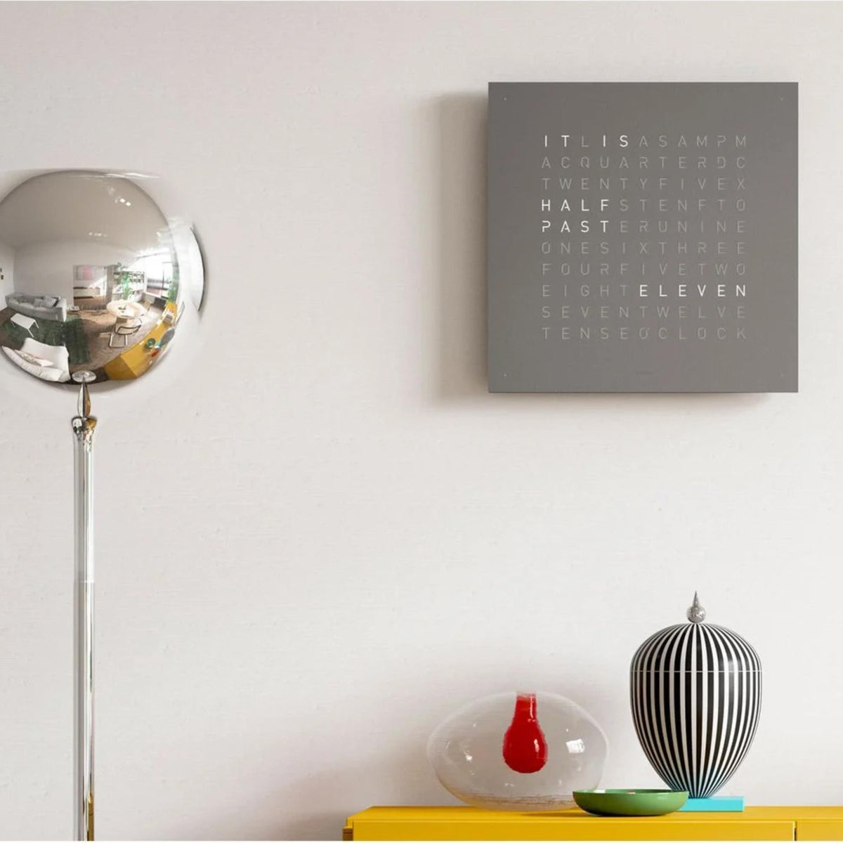 QLOCKTWO Earth 45 grey square wall clock mounted on wall, English word grid