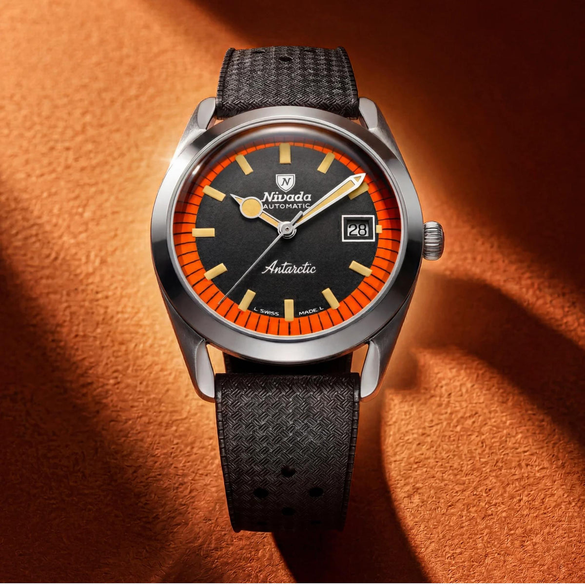 Men's automatic watch with black dial and orange bezel ring, date window, black rubber strap