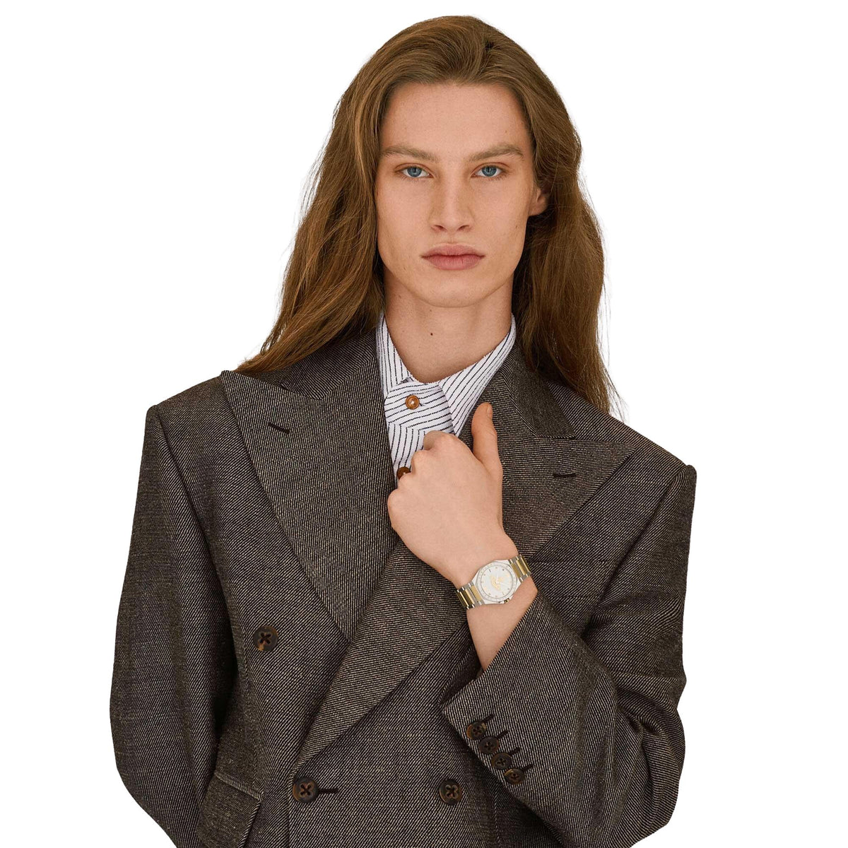 Two-tone steel quartz watch on wrist with silver dial and gold accents