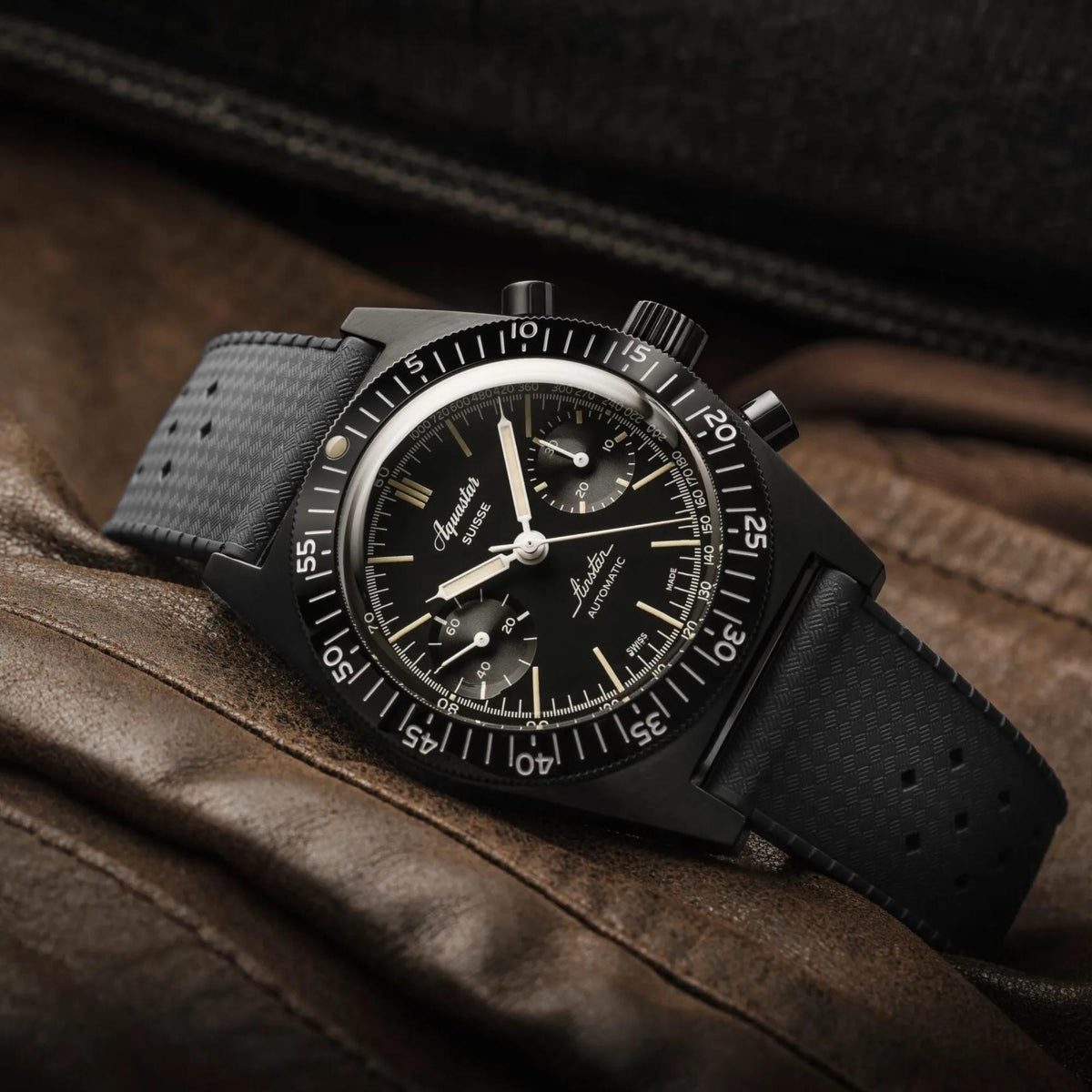 Men's Aquastar chronograph watch with black dial and black strap, three-register design