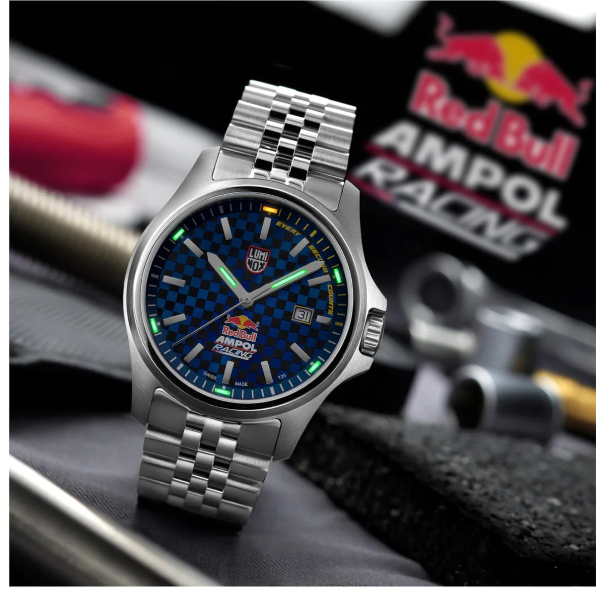 Luminox Atacama Field XL.2523.ARB.N steel mens watch resting on a racing gear background