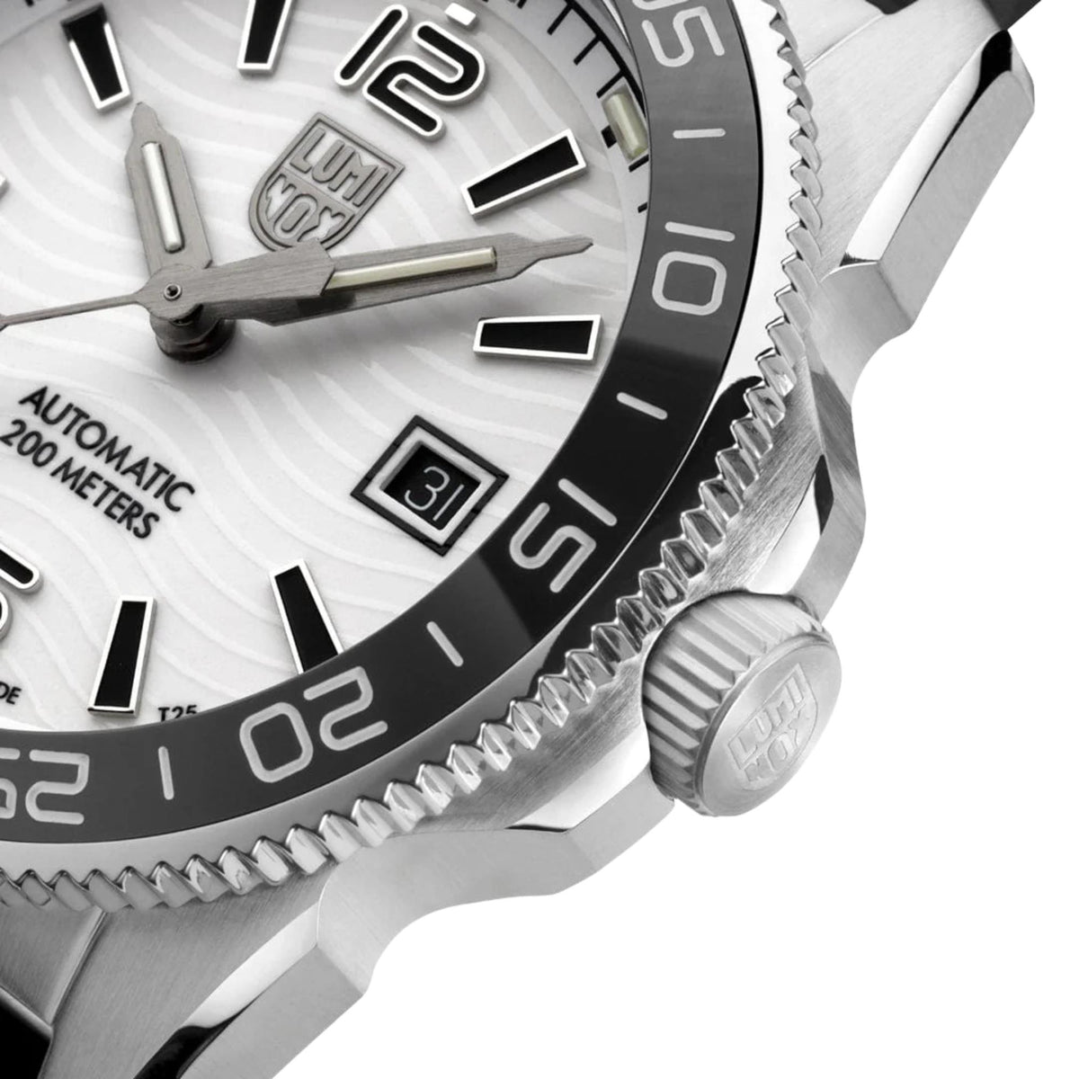 Close-up of diver watch dial with luminous hands, bezel markings, and date window