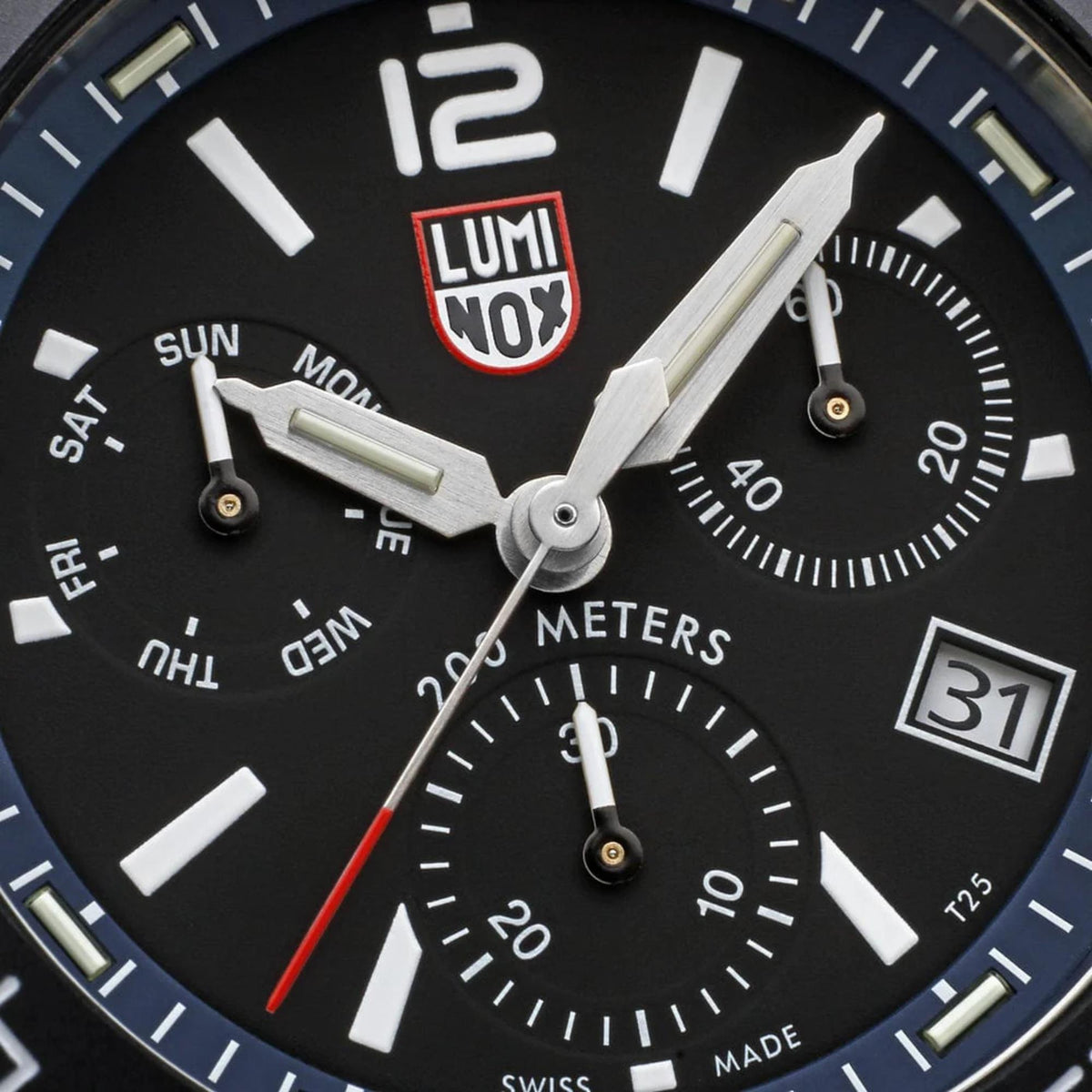 Close-up of black chronograph watch dial with LUMINOX branding and luminous markers
