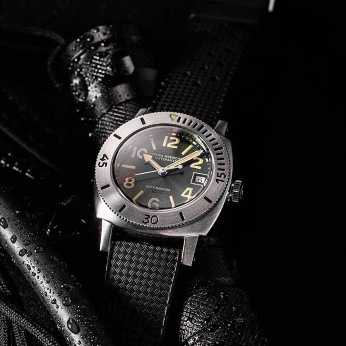 Nivada Grenchen Depthmaster 14103A01 lifestyle view on textured black background