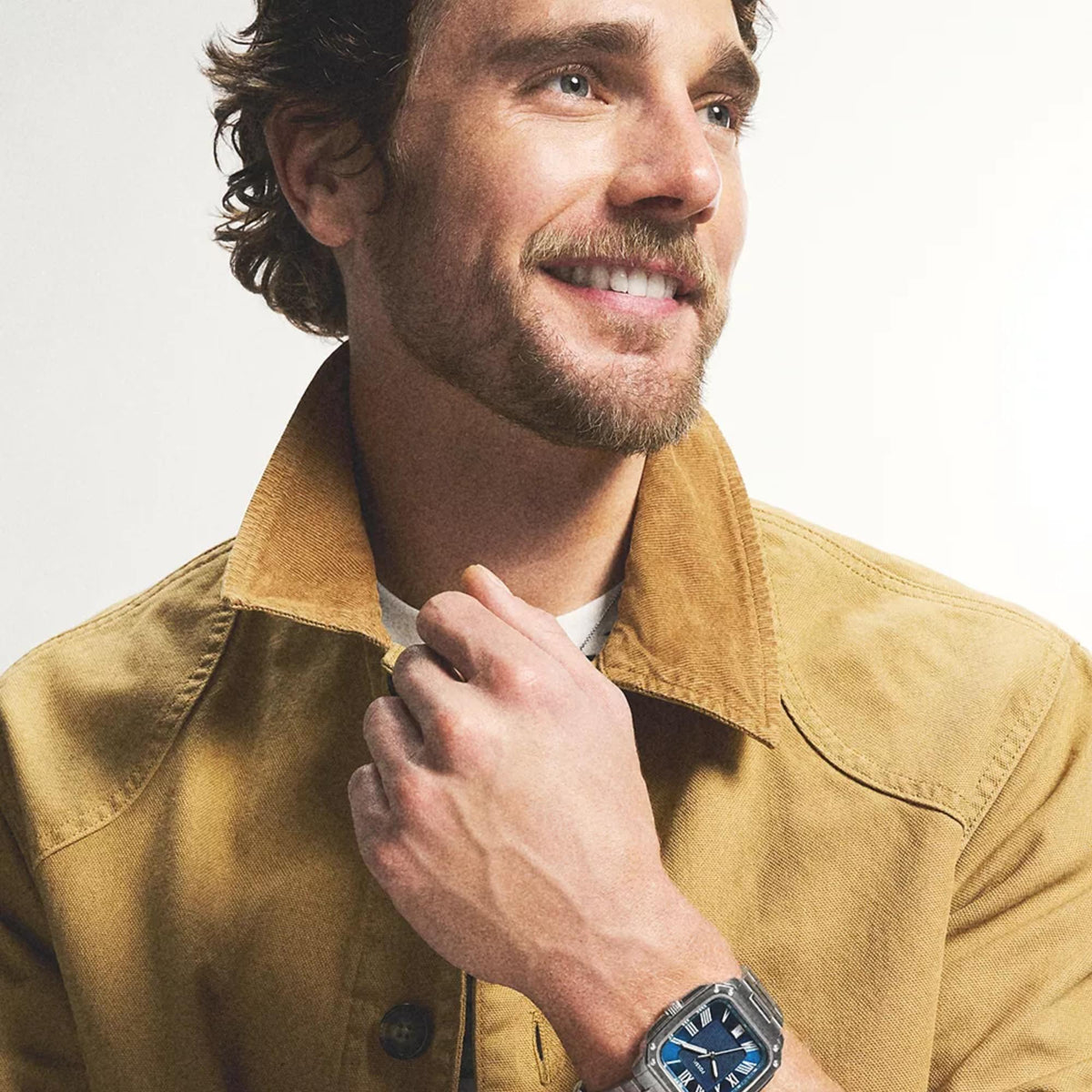 Lifestyle view of the Fossil Crosby FS6121 quartz timepiece showcased on a wrist, featuring a blue dial display and brushed steel bezel
