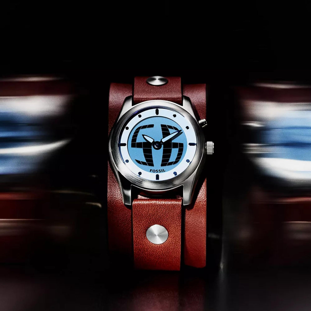 Front view of the Fossil Y2K Big Tic LE1229 watch highlighting the illuminated digital dial and brown leather band against a dark backdrop